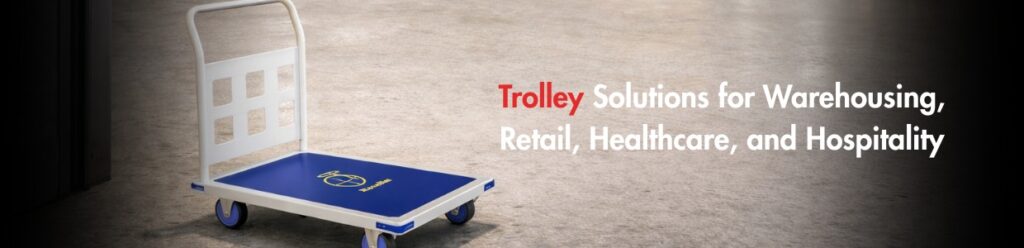 Industrial platform trolley with handle shown in a warehouse setting, representing trolley solutions for warehousing, retail, healthcare, and hospitality use.